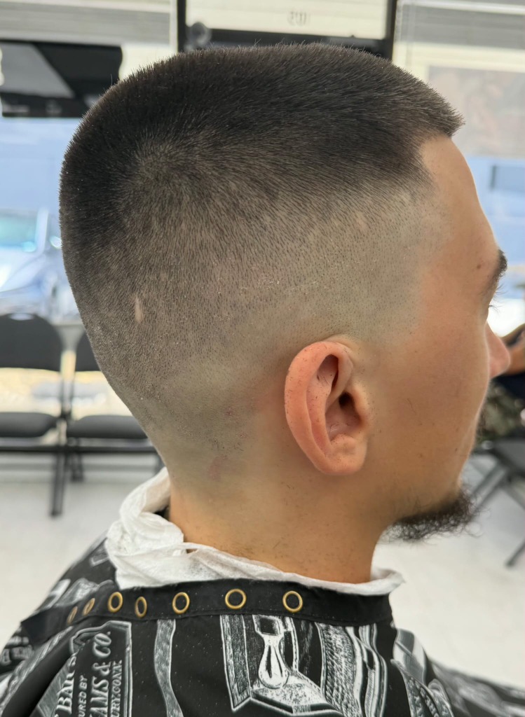 Clean skin fade haircut — after Tom's Barber Honolulu