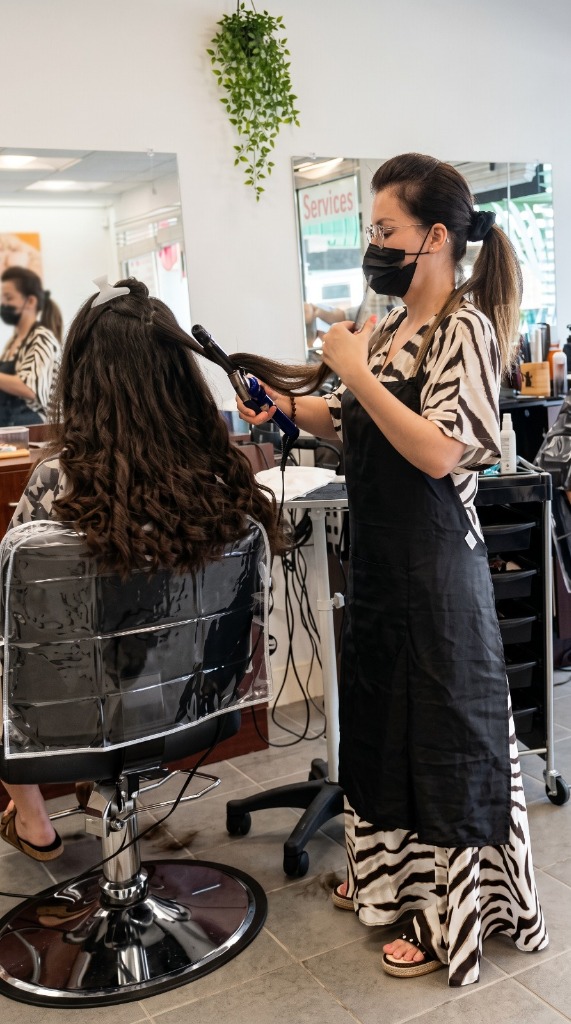 Ladies styling service — expert curling iron finish